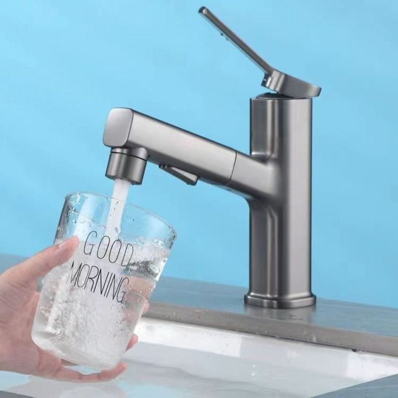 BowLift | Modern bathroom sink faucet with brass lever handles and swivel spout