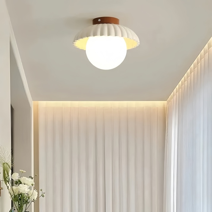 BowLift | Ceiling lamp with a milk glass shade providing warm lighting in the hallway