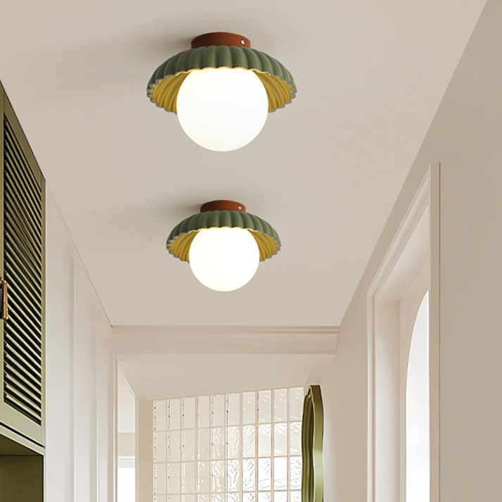 BowLift | Ceiling lamp with a milk glass shade providing warm lighting in the hallway