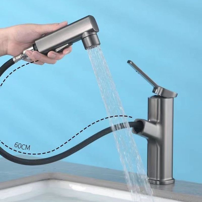 BowLift | Modern bathroom sink faucet with brass lever handles and swivel spout