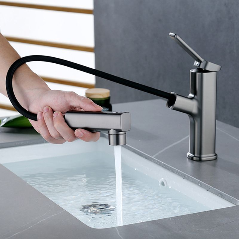 BowLift | Modern bathroom sink faucet with brass lever handles and swivel spout