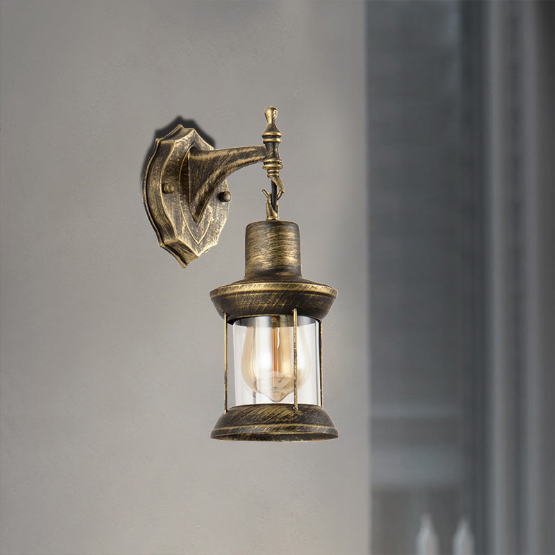 BowLift | An E27 wall light with a petroleum shade made of clear glass Traditional outdoor wall light in antique bronze