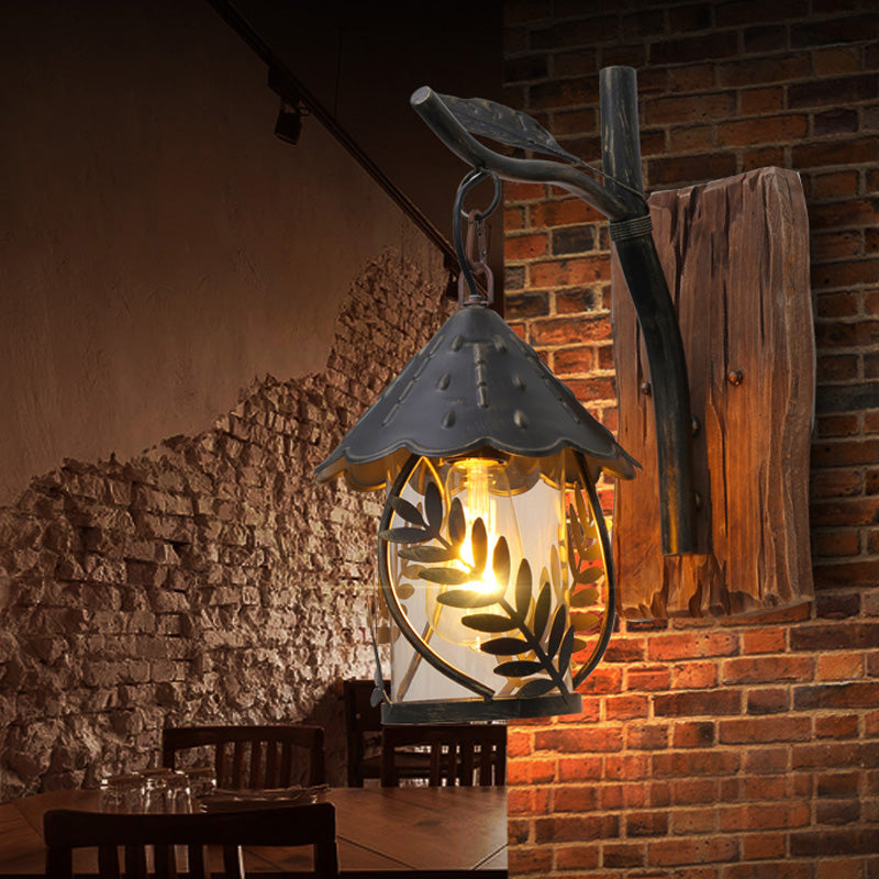 BowLift | A wall lamp with a glass bulb and cylindrical shade made of clear glass, industrial wall lamp for the living room with leaf branch in black