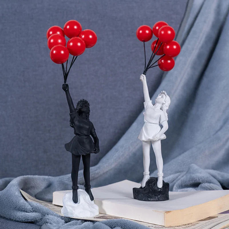 Skulptur eines Mädchen mit Ballon im Banksy-Stil für Tischdekoration und kreative Wohnzimmerdekoration