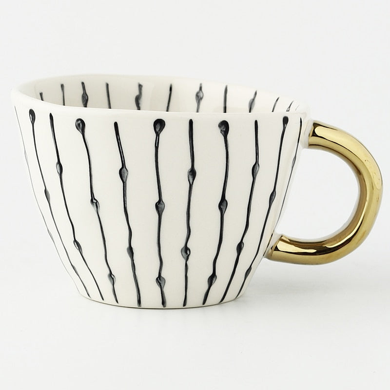 BowLift | Cup with abstract geometric pattern and gold handle