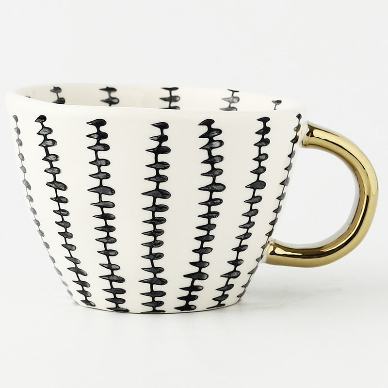 BowLift | Cup with abstract geometric pattern and gold handle