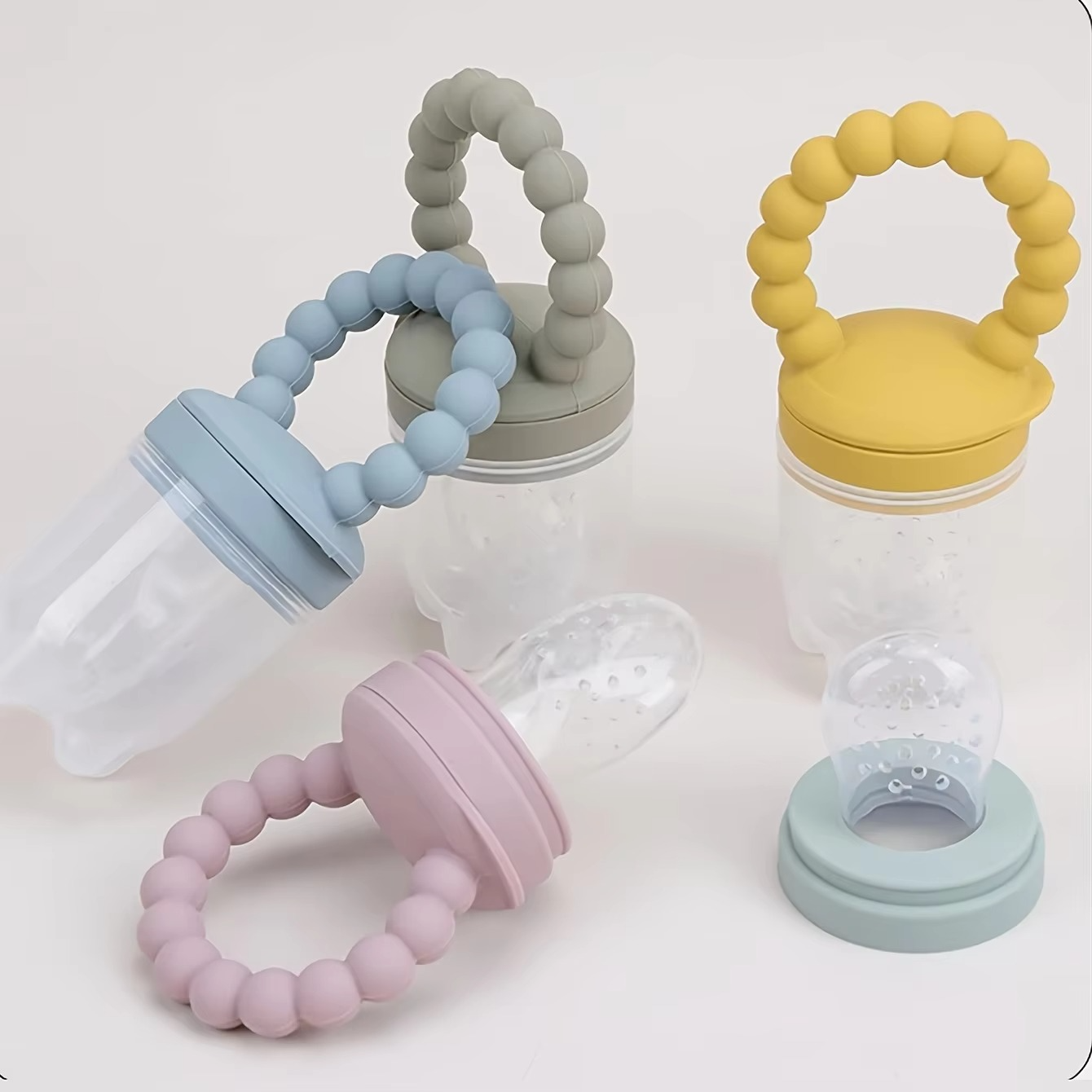 BowLift | 4-Piece Silicone Baby Fruit Feeder Set with Comfort Grip Handle and Extra Feeding Pouches