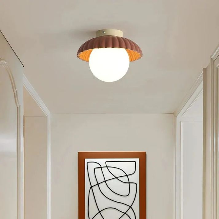 BowLift | Ceiling lamp with a milk glass shade providing warm lighting in the hallway