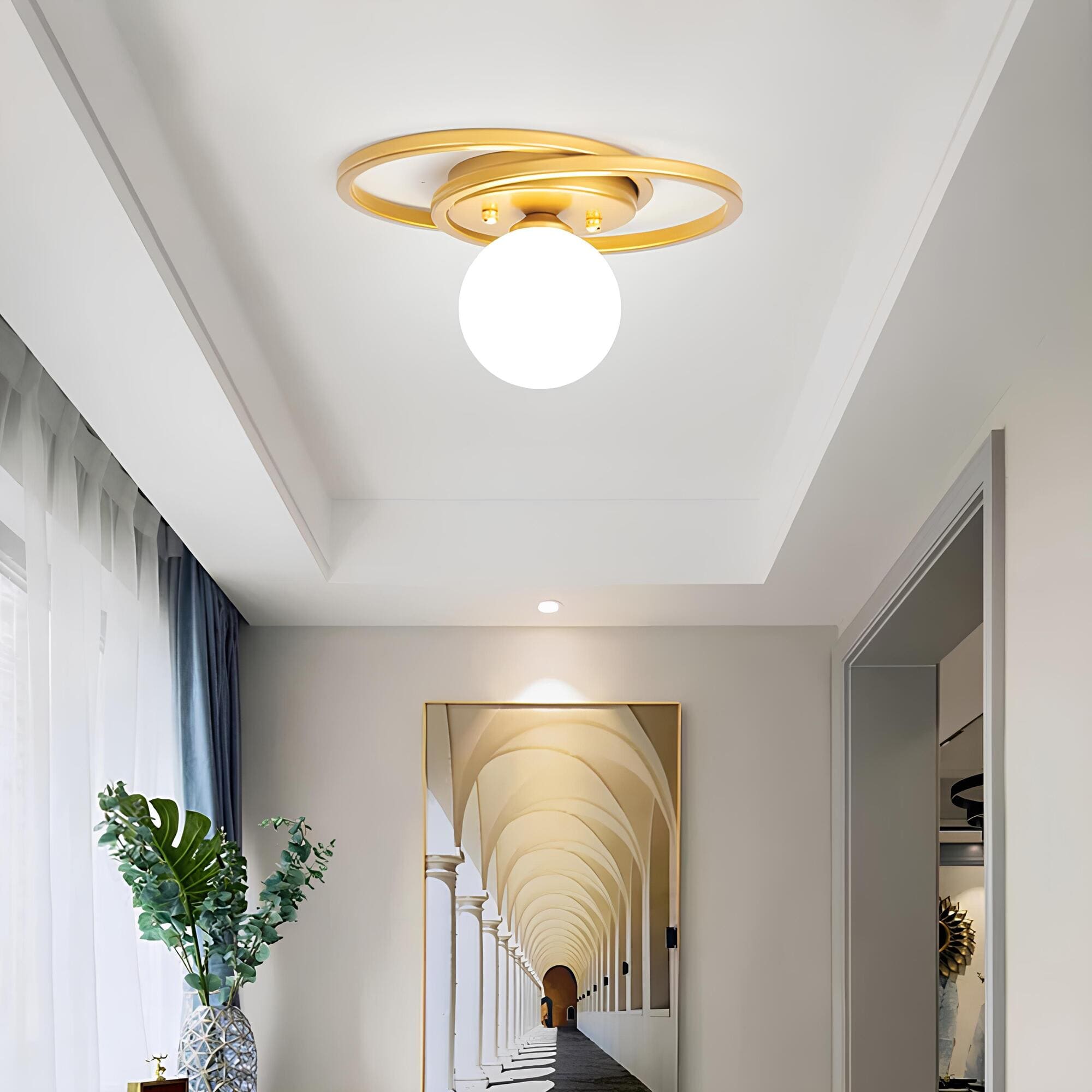 BowLift | LumiNoble | Timeless ceiling light with golden LED ball design