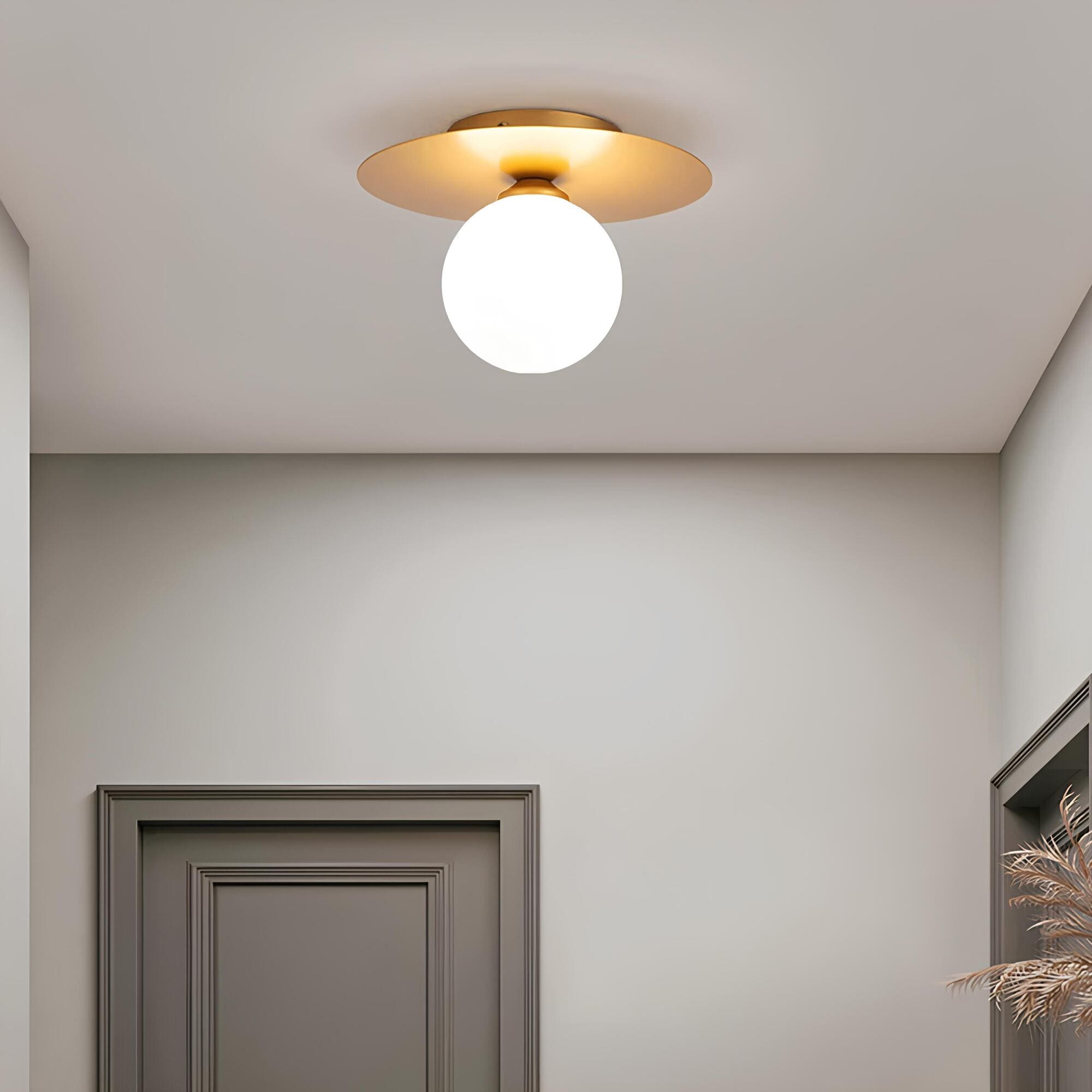 BowLift | LumiNoble | Timeless ceiling light with golden LED ball design